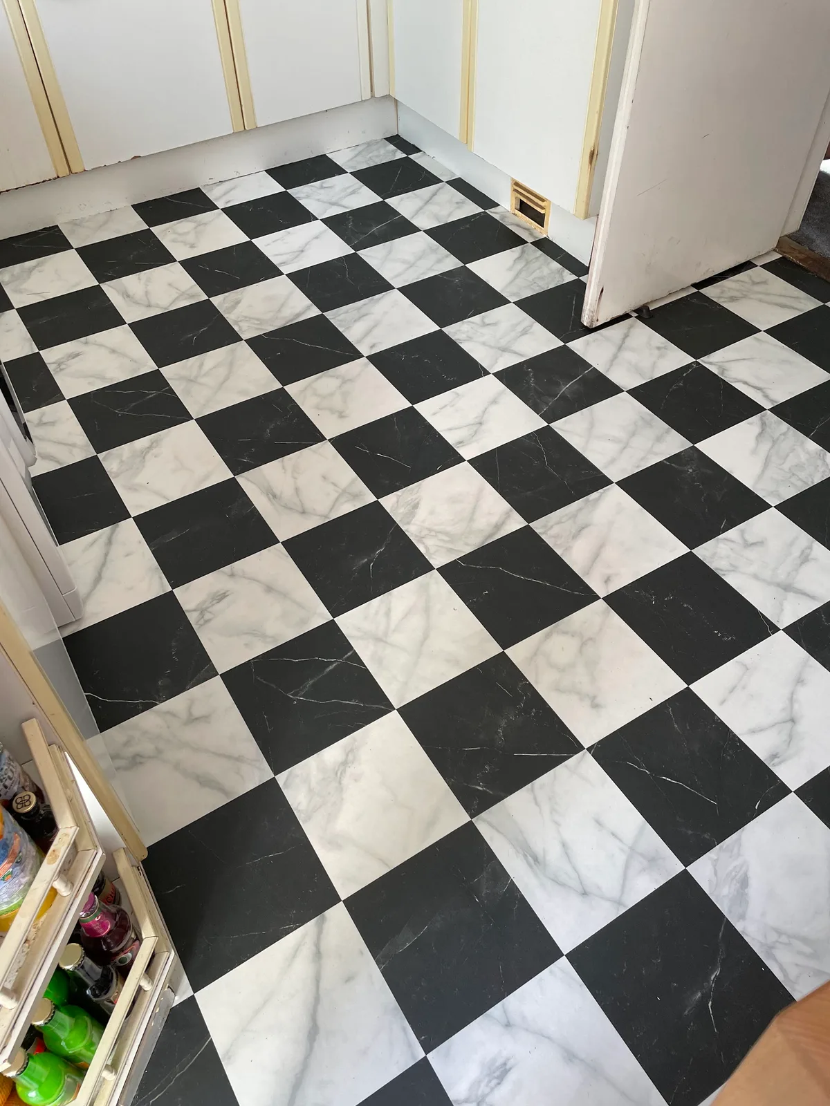 Precisely fitted black and white chequerboard floor