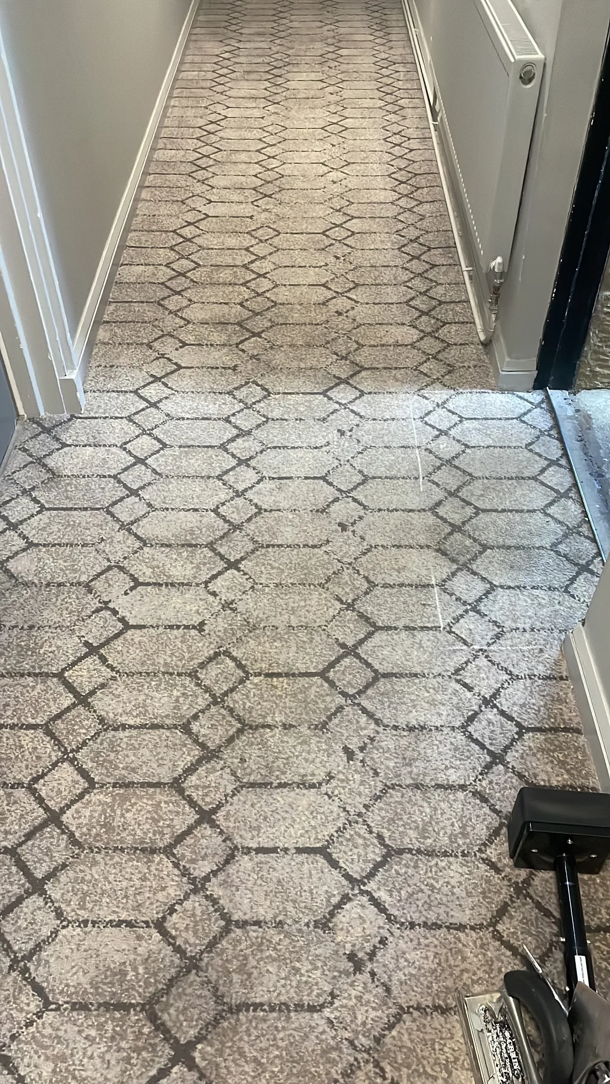 Soft grey patterned carpet fitted in a hallway